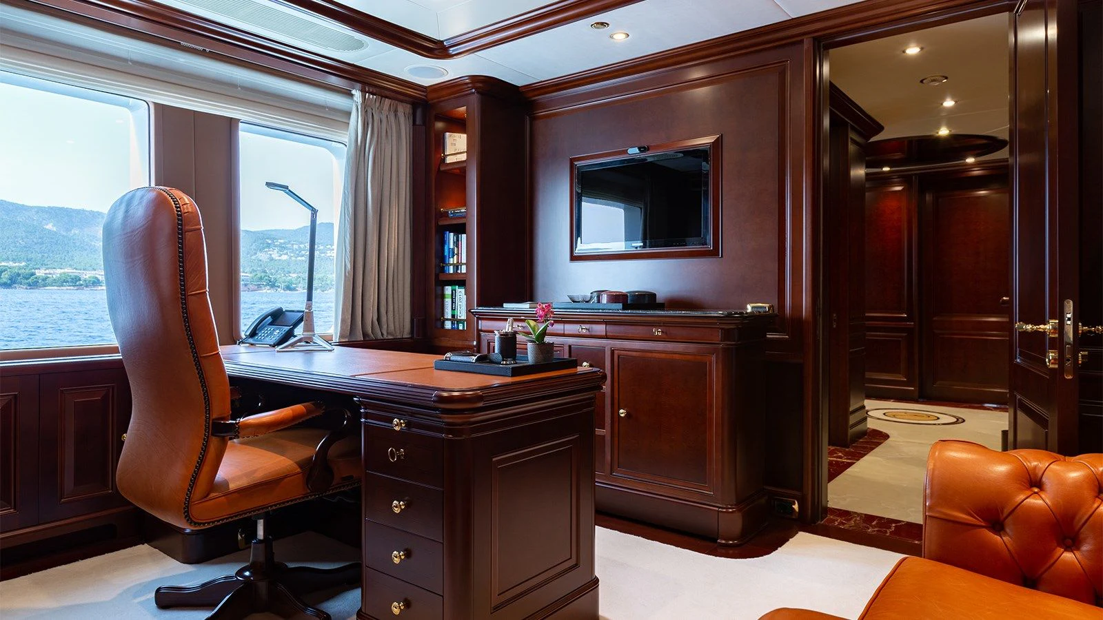 a room with a desk and a chair aboard INCAL Yacht for Sale