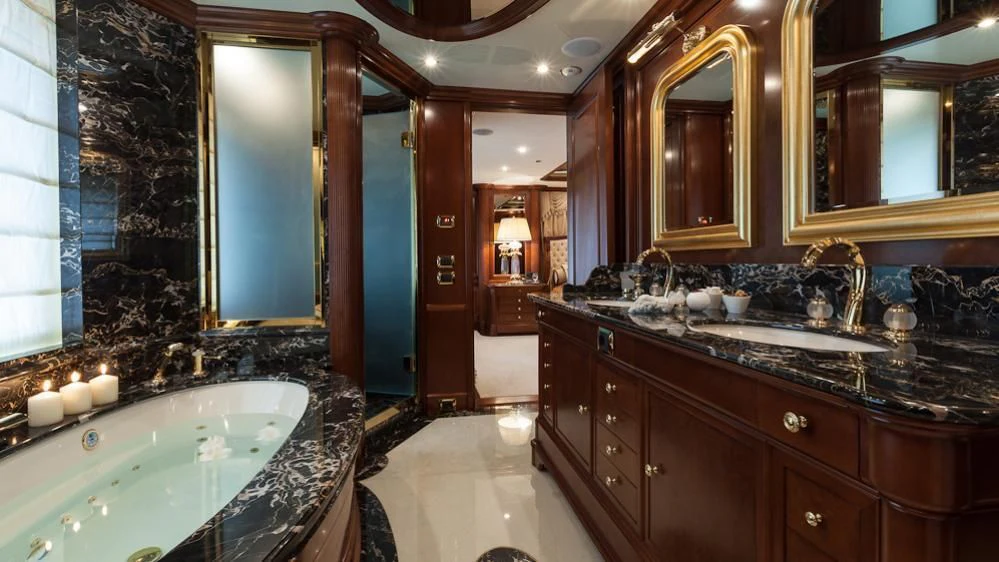 a bathroom with a large bathtub aboard INCAL Yacht for Sale