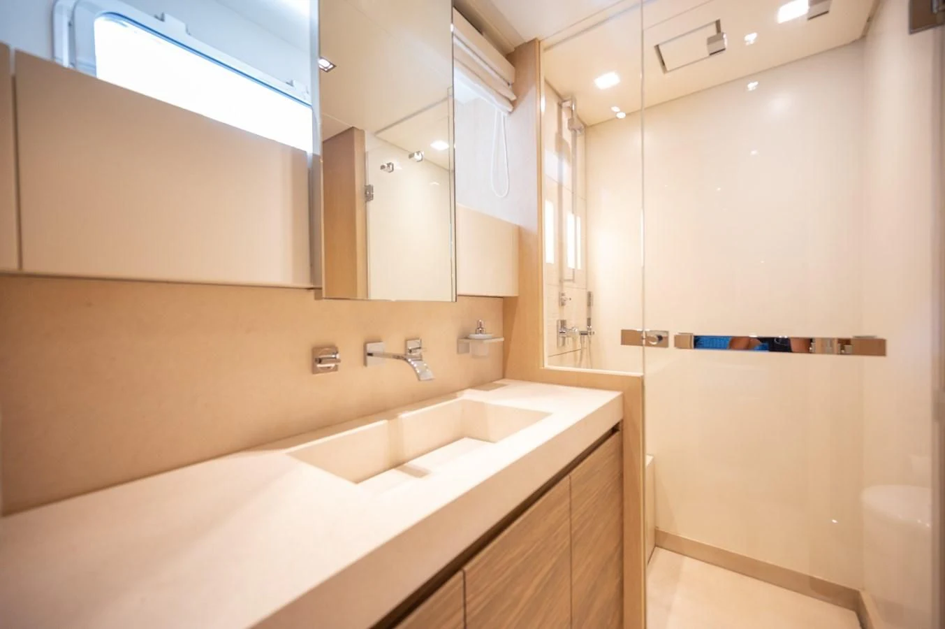 a bathroom with a large mirror aboard ASTONISH Yacht for Sale