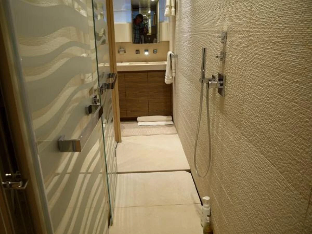 a bathroom with a shower and sink aboard ASTONISH Yacht for Sale