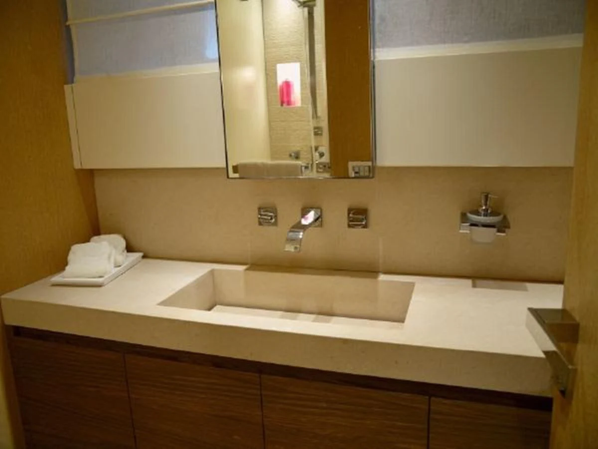 a bathroom with a large mirror aboard ASTONISH Yacht for Sale