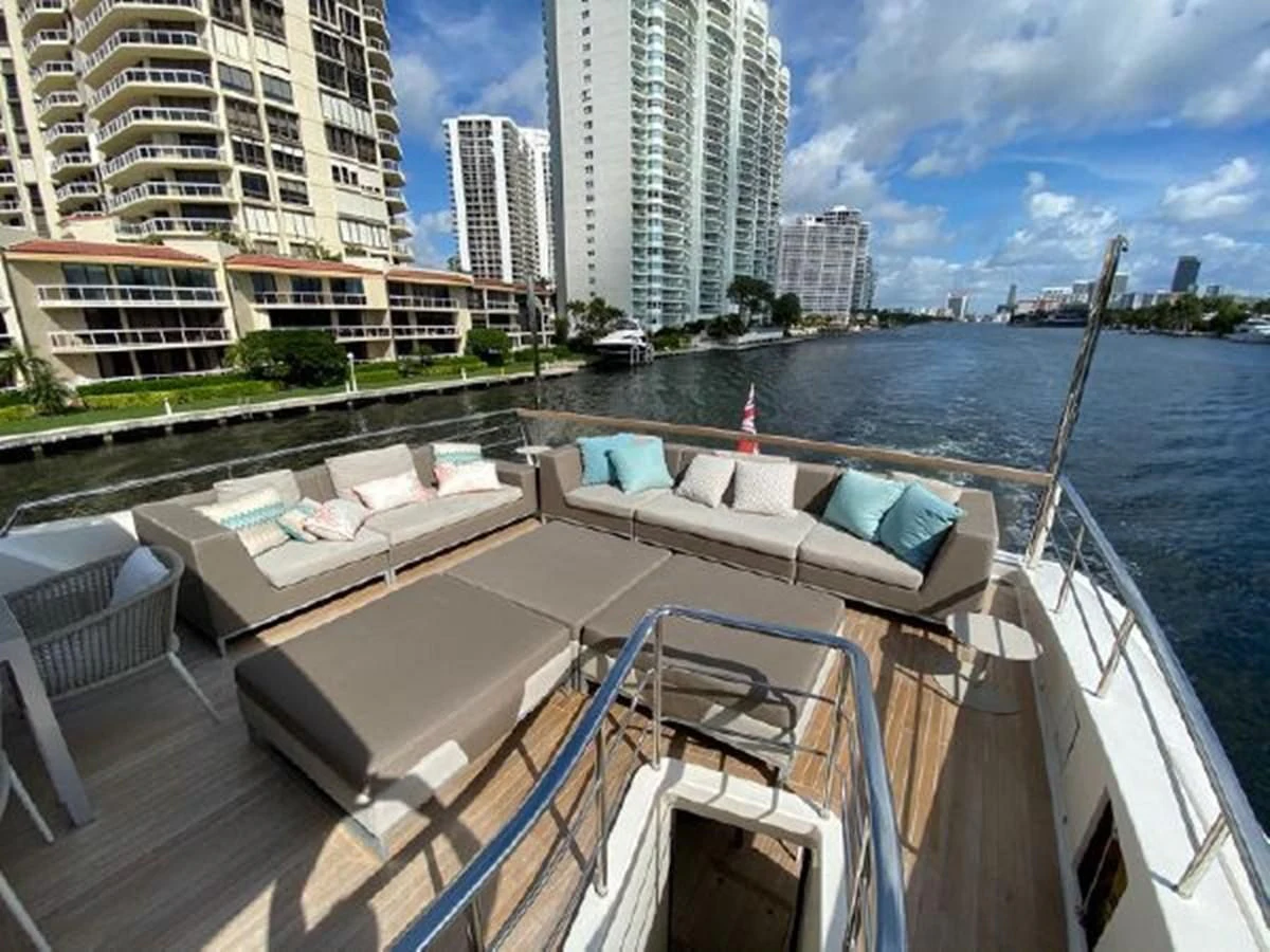 a deck with a view of a city and water aboard ASTONISH Yacht for Sale