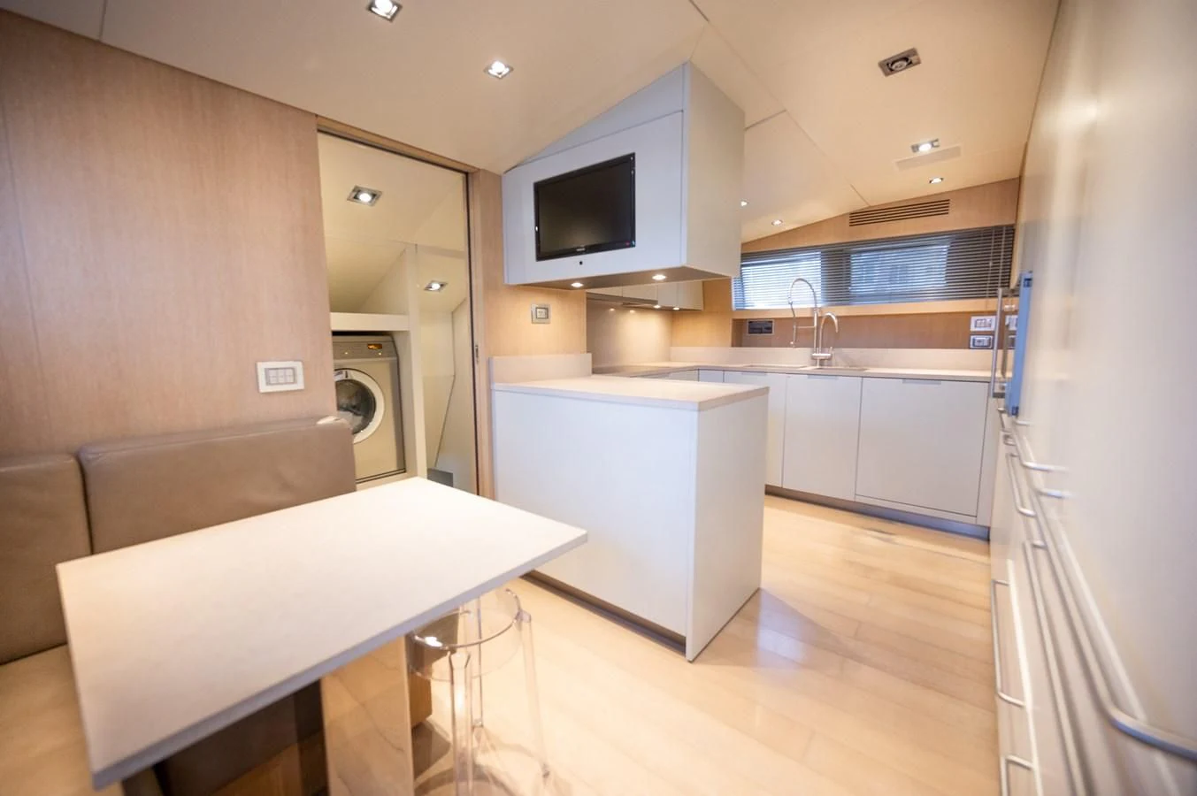 a kitchen with a table and a microwave aboard ASTONISH Yacht for Sale