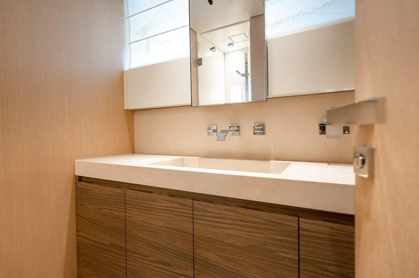 a bathroom with a sink and cabinets aboard ASTONISH Yacht for Sale