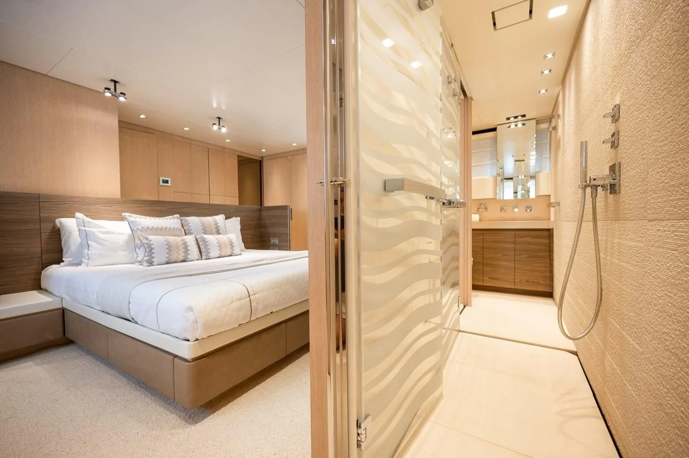 a room with a bed and a closet aboard ASTONISH Yacht for Sale