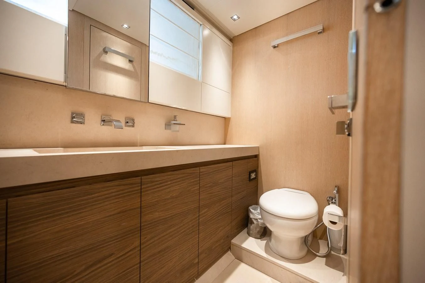 a bathroom with wooden cabinets aboard ASTONISH Yacht for Sale