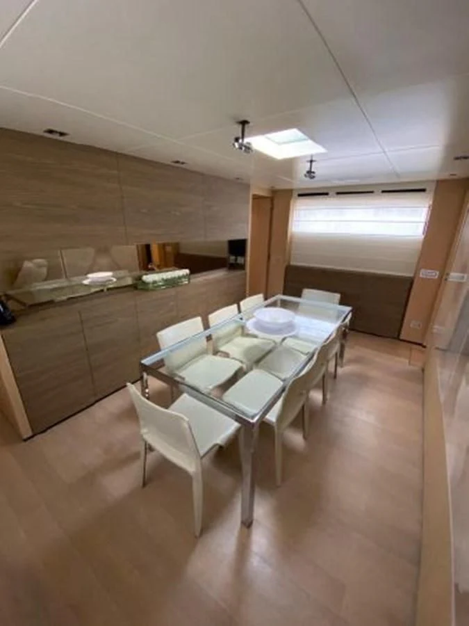 a room with a table and chairs aboard ASTONISH Yacht for Sale