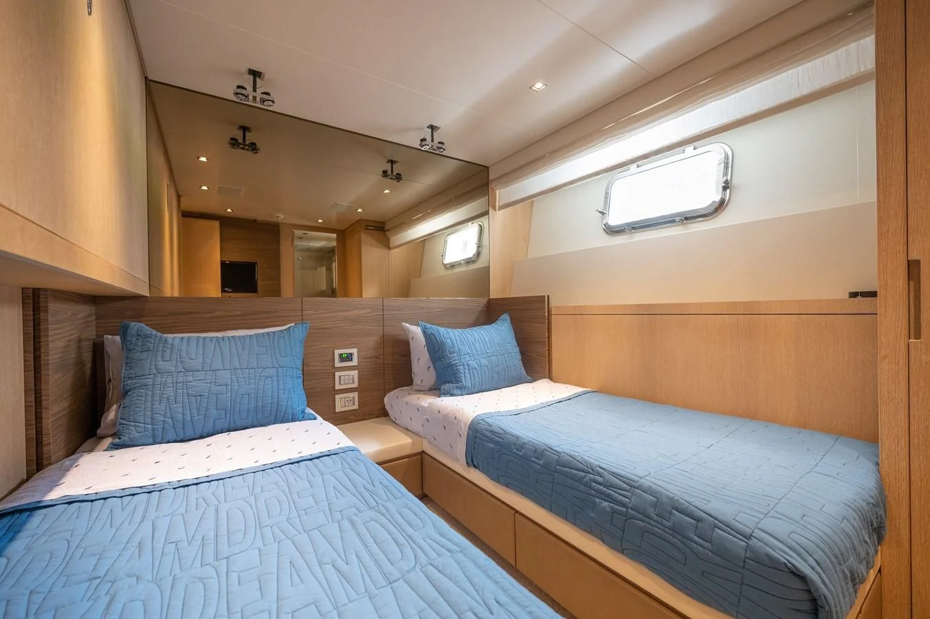 a couple of beds in a hotel room aboard ASTONISH Yacht for Sale