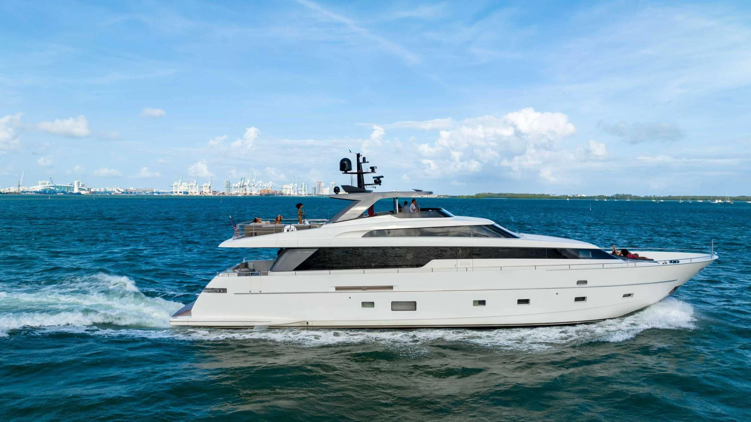 a white yacht in the water aboard ASTONISH Yacht for Sale