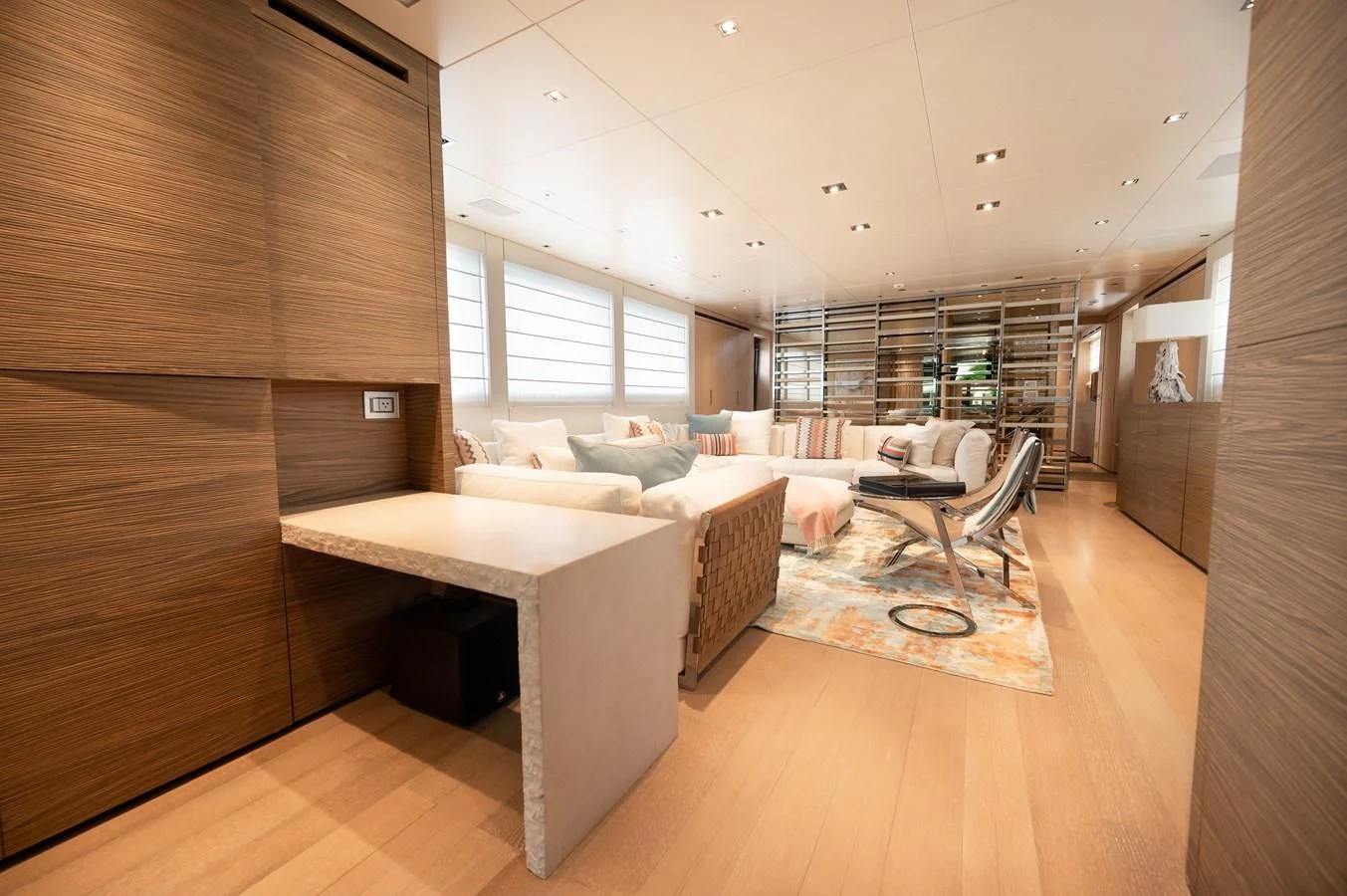 a large room with a bed and a couch aboard ASTONISH Yacht for Sale