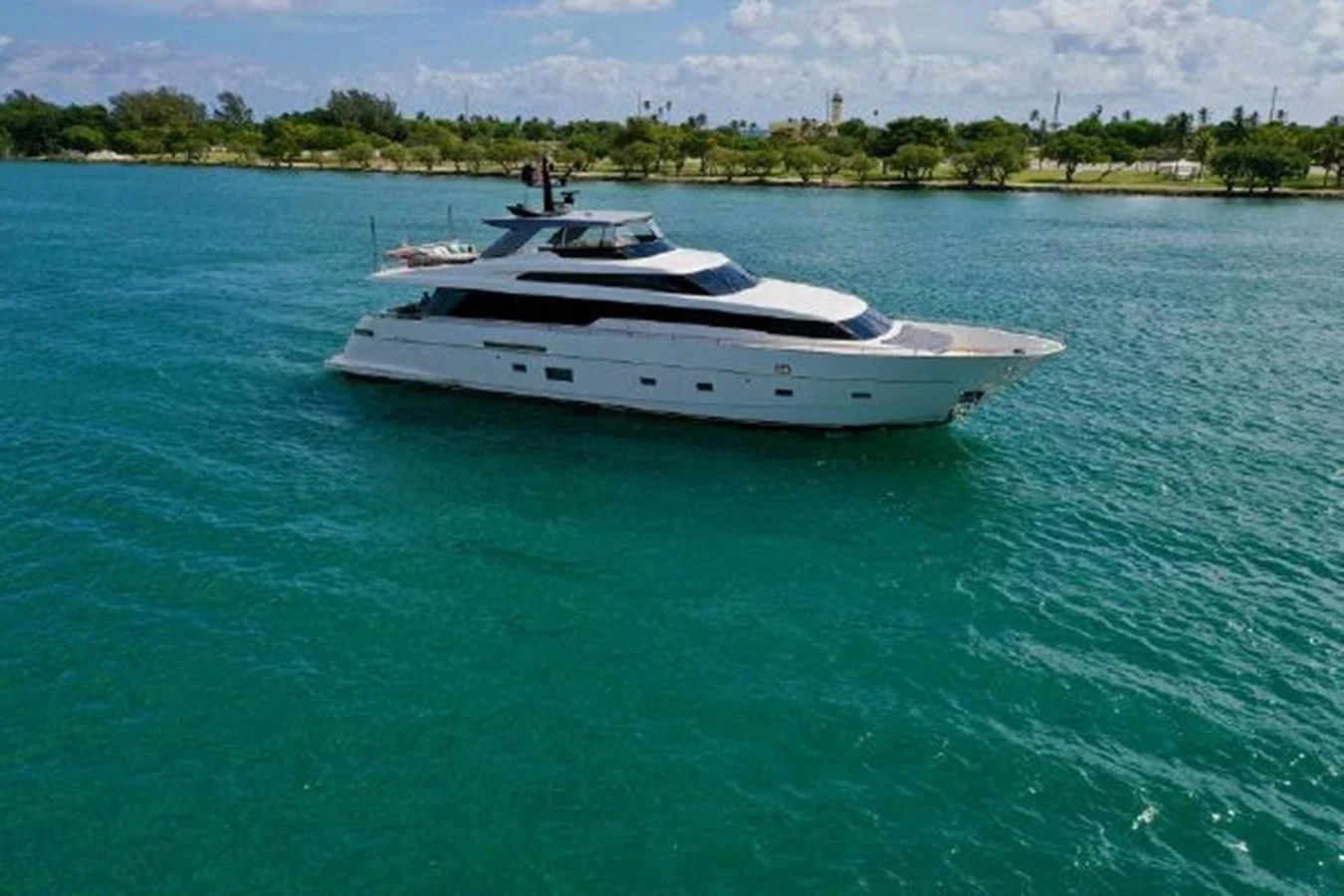 a white boat in the water aboard ASTONISH Yacht for Sale