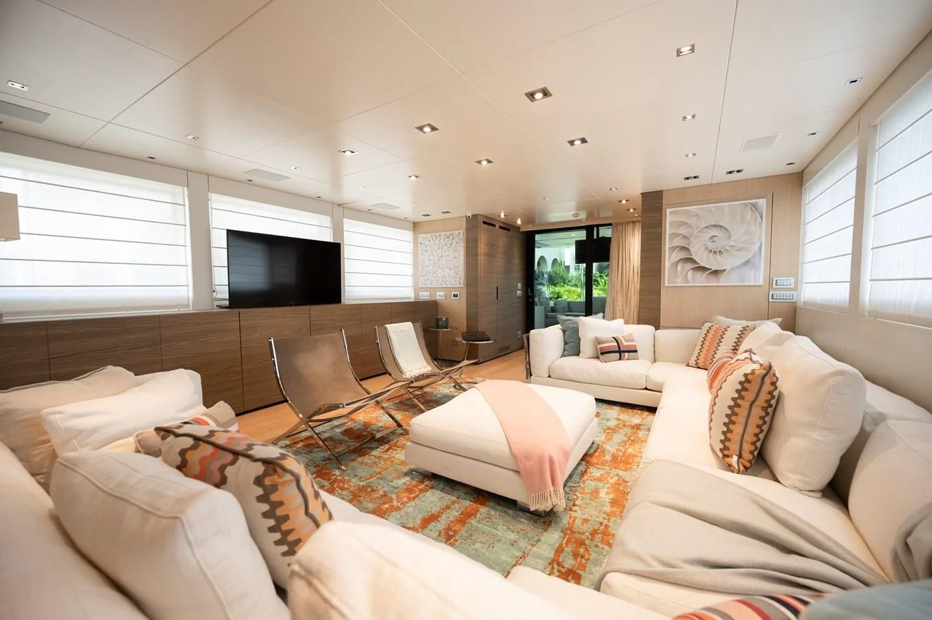 a living room with white furniture aboard ASTONISH Yacht for Sale