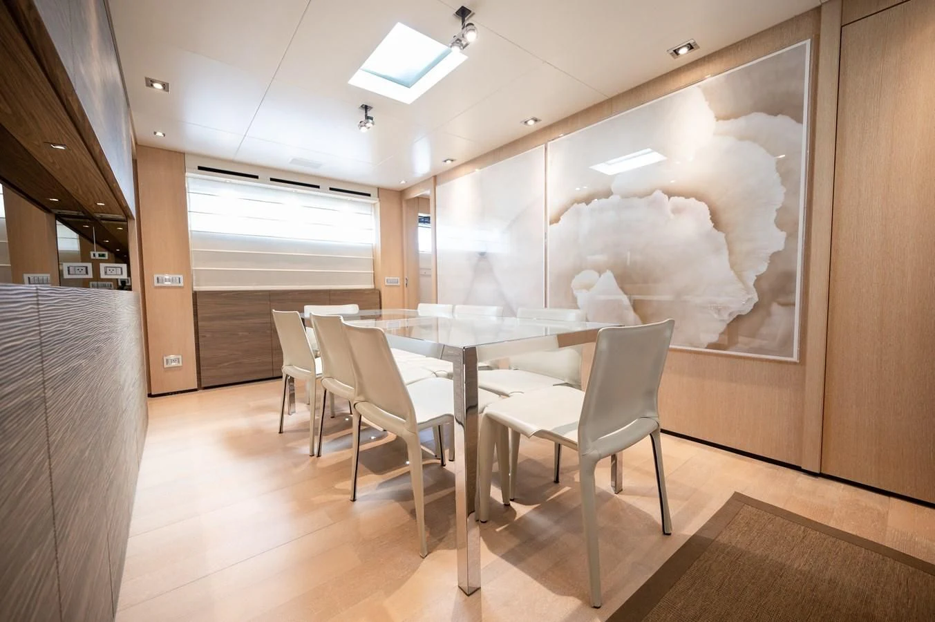 a room with tables and chairs aboard ASTONISH Yacht for Sale