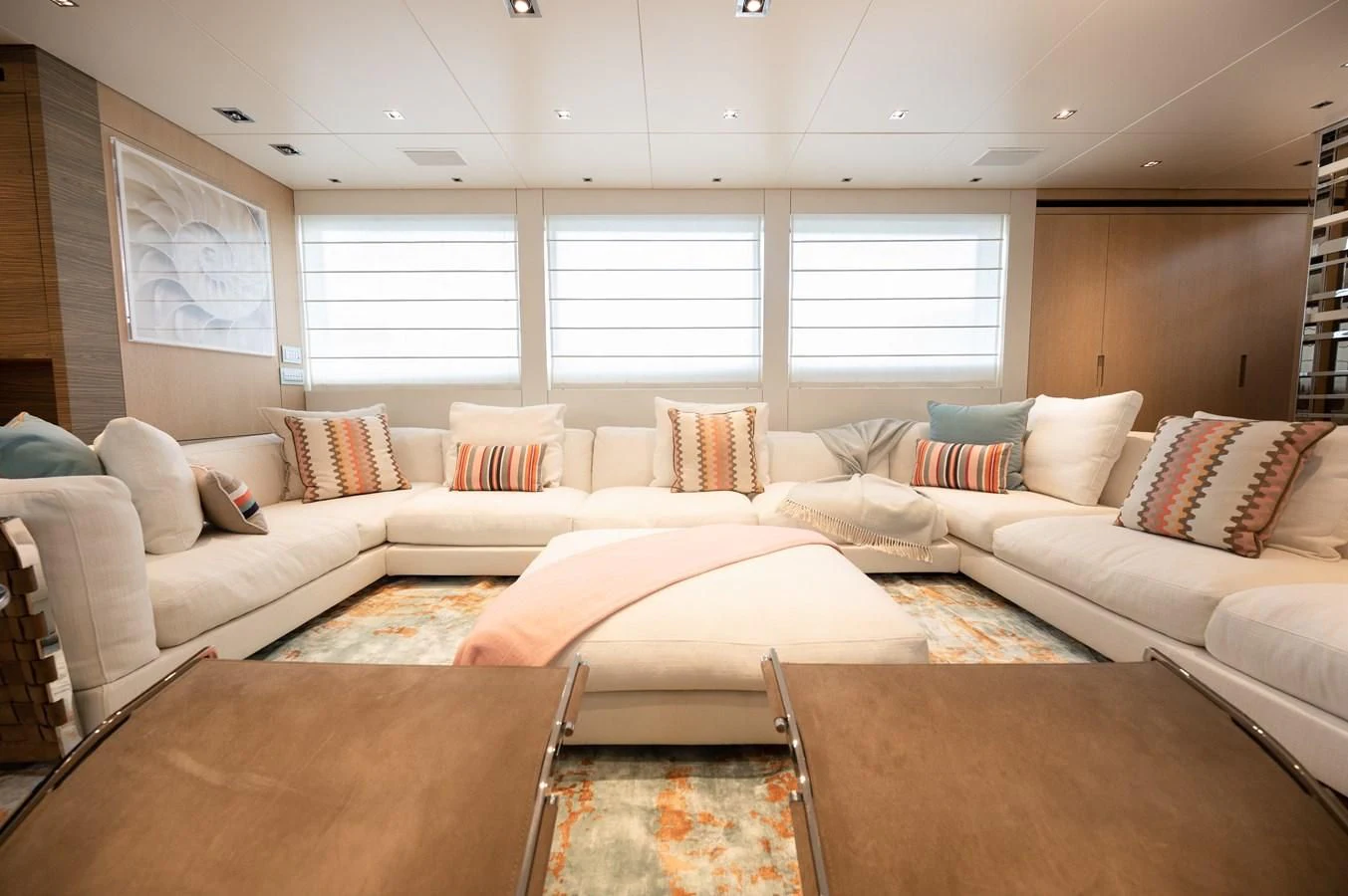 a living room with a couch and a table aboard ASTONISH Yacht for Sale