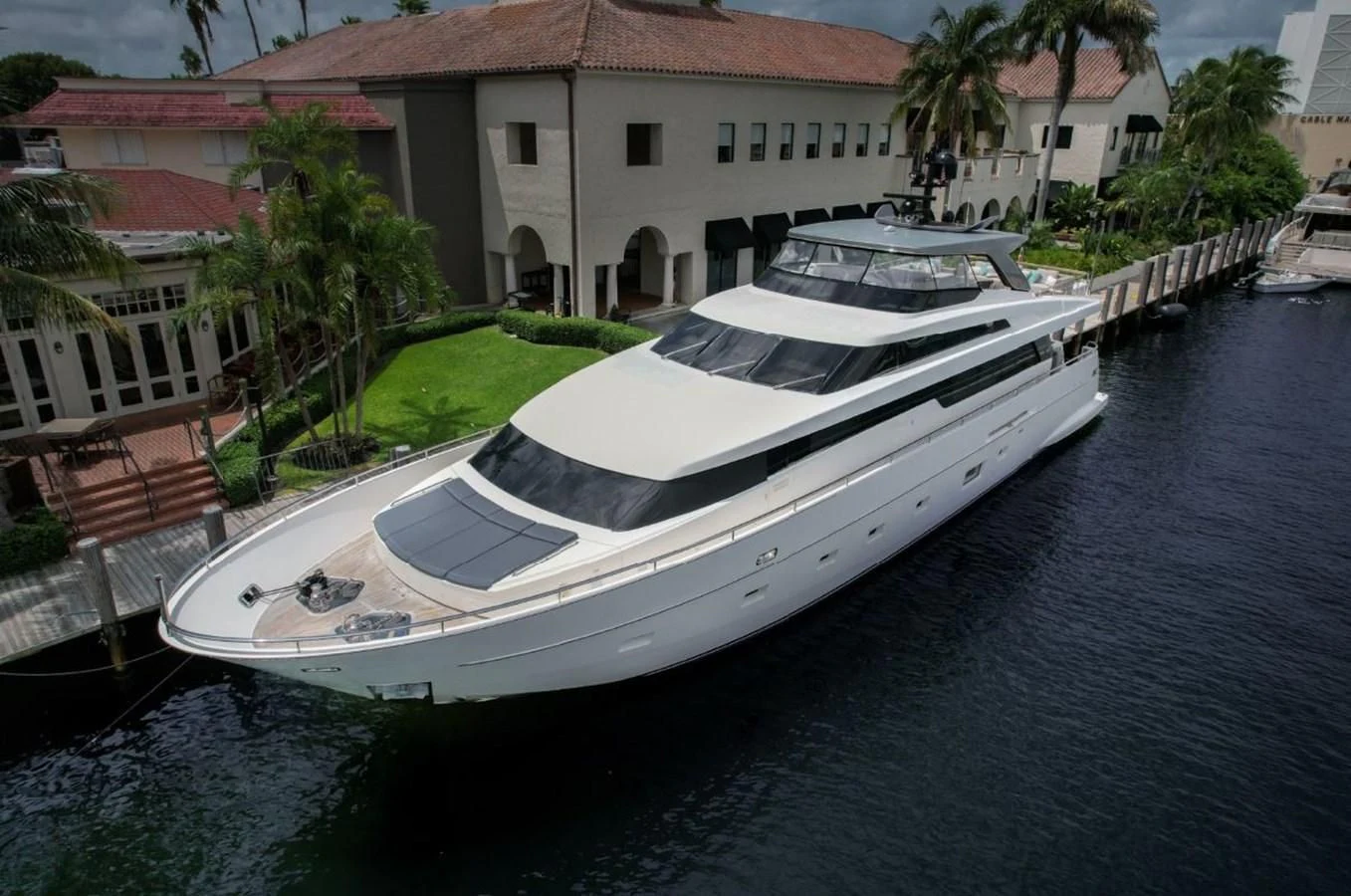 a white boat in a canal aboard ASTONISH Yacht for Sale
