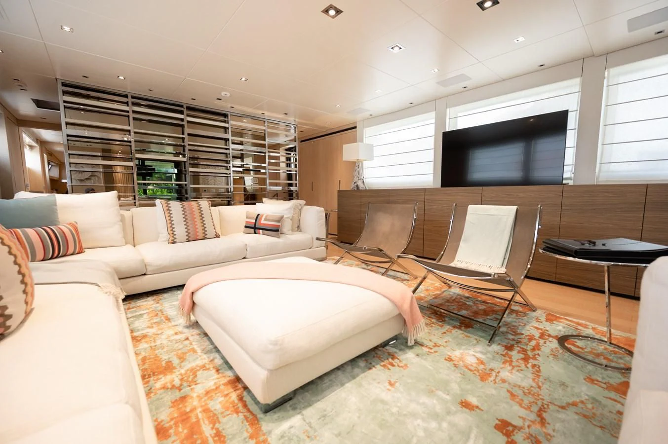 a living room with a couch and a table aboard ASTONISH Yacht for Sale