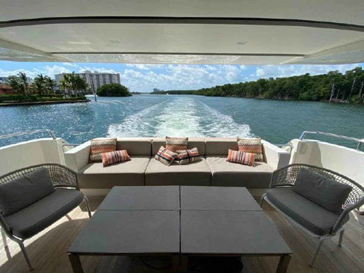 a room with a view of the ocean and a beach aboard ASTONISH Yacht for Sale