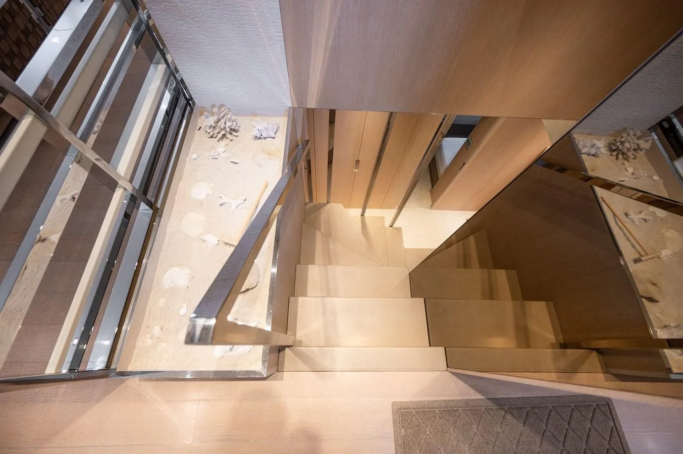 a staircase with glass doors aboard ASTONISH Yacht for Sale