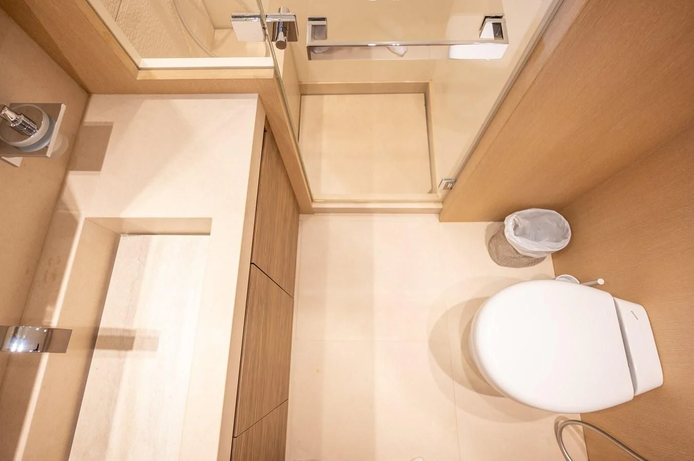 a toilet in a bathroom aboard ASTONISH Yacht for Sale