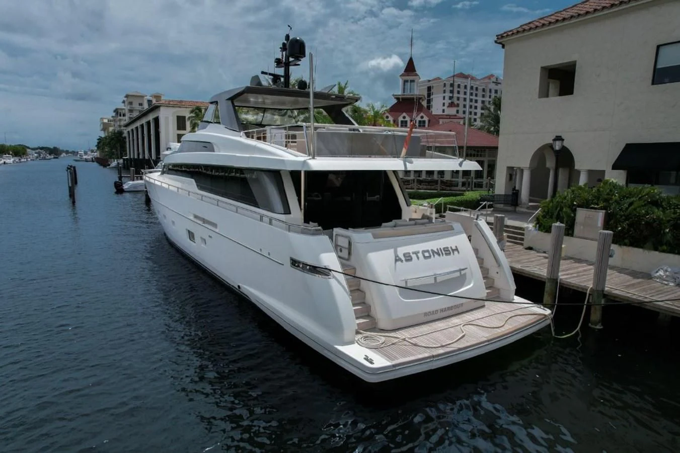 a boat docked at a pier aboard ASTONISH Yacht for Sale
