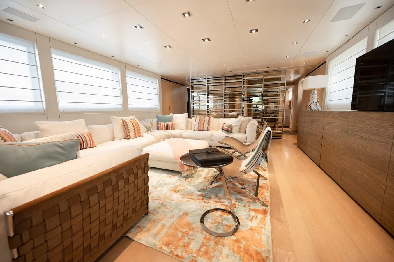 a living room with a couch and a coffee table aboard ASTONISH Yacht for Sale