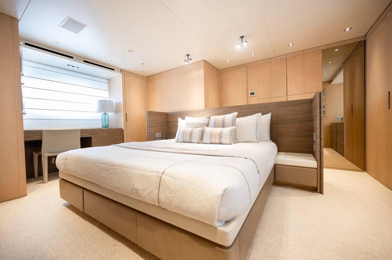 a large bed in a room aboard ASTONISH Yacht for Sale
