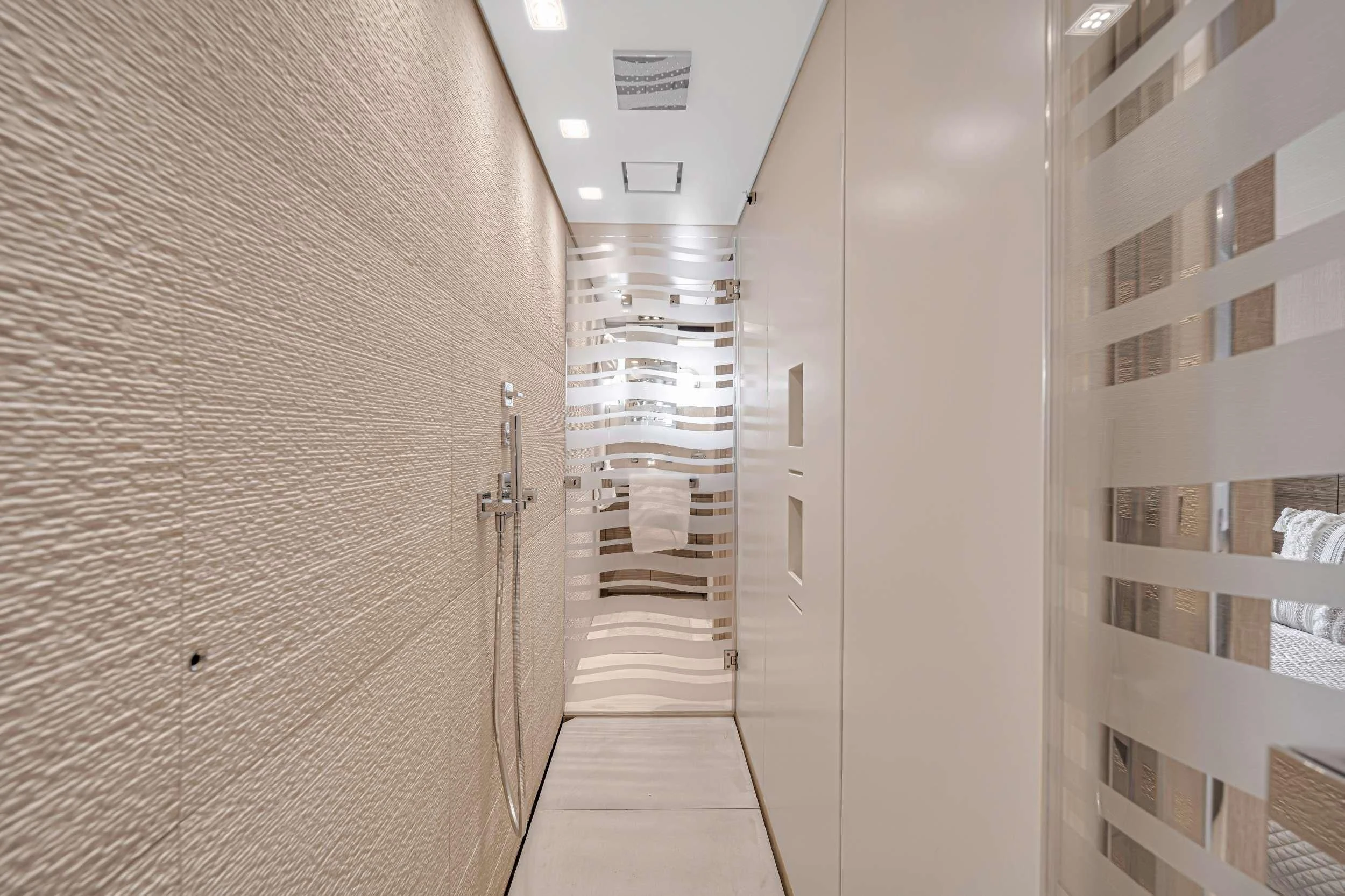 a hallway with white walls aboard ASTONISH Yacht for Sale