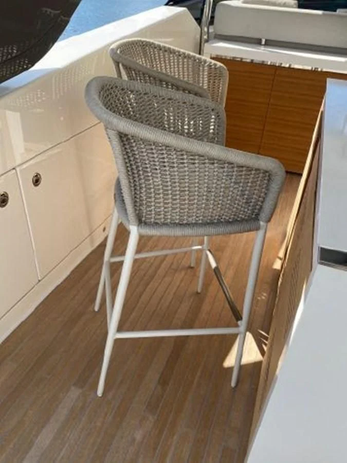 a white chair in a room aboard ASTONISH Yacht for Sale
