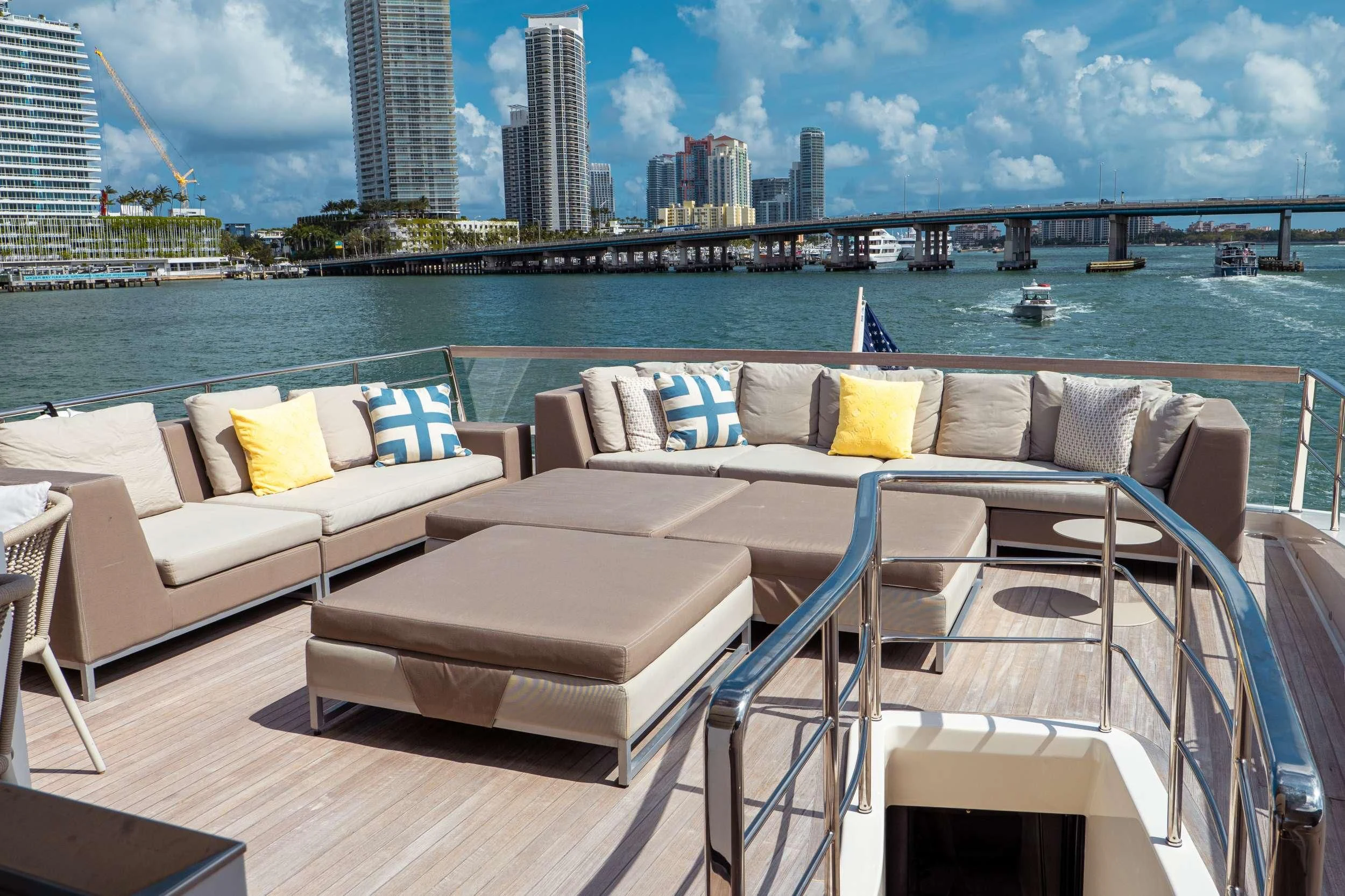 a balcony with a view of a city and a body of water aboard ASTONISH Yacht for Sale