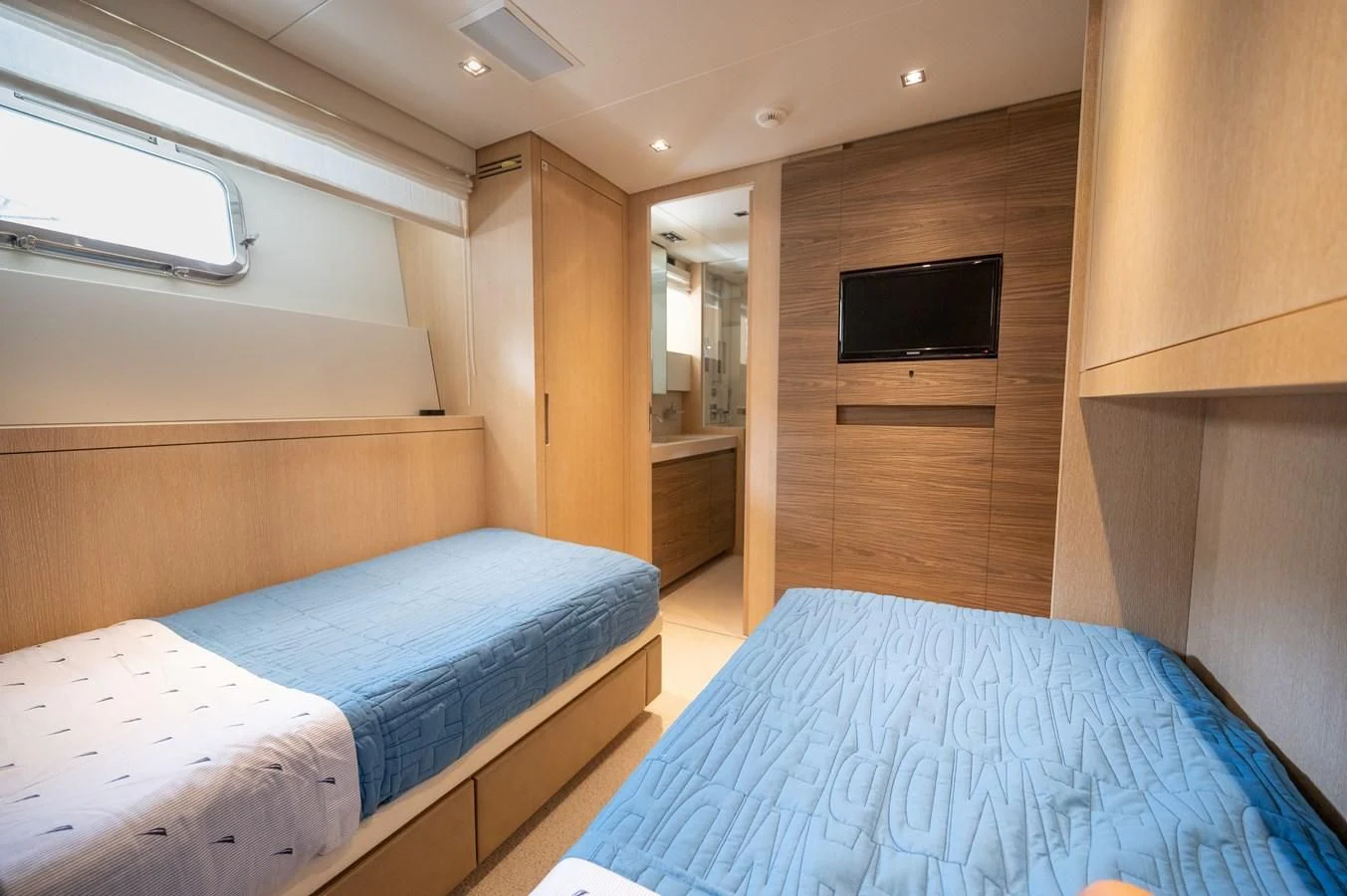 a room with two beds aboard ASTONISH Yacht for Sale