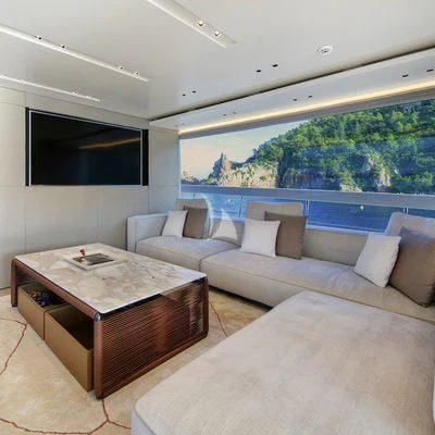 a living room with a couch and a table aboard BELLE DE NUIT Yacht for Sale