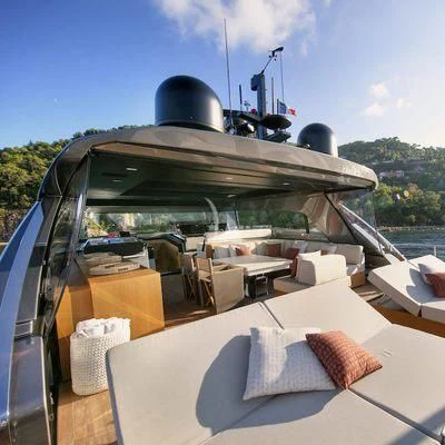 a boat with a deck and chairs on the deck aboard BELLE DE NUIT Yacht for Sale