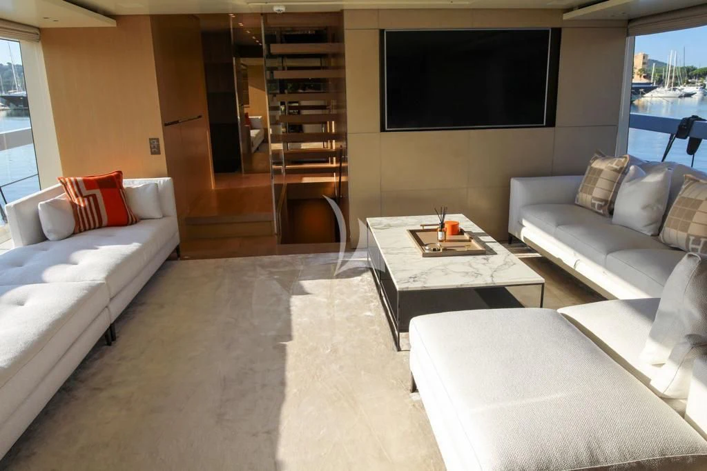 a living room with a large tv aboard BELLE DE NUIT Yacht for Sale