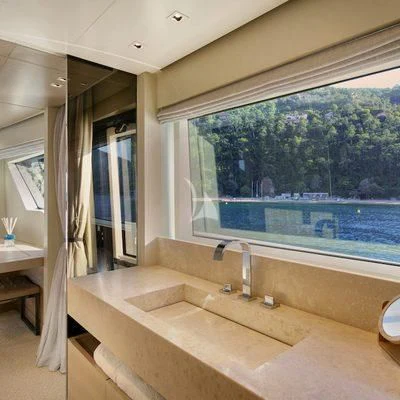 a bathroom with a large window aboard BELLE DE NUIT Yacht for Sale