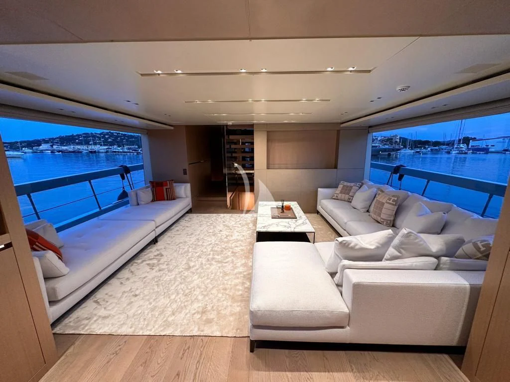 a living room with a large window aboard BELLE DE NUIT Yacht for Sale