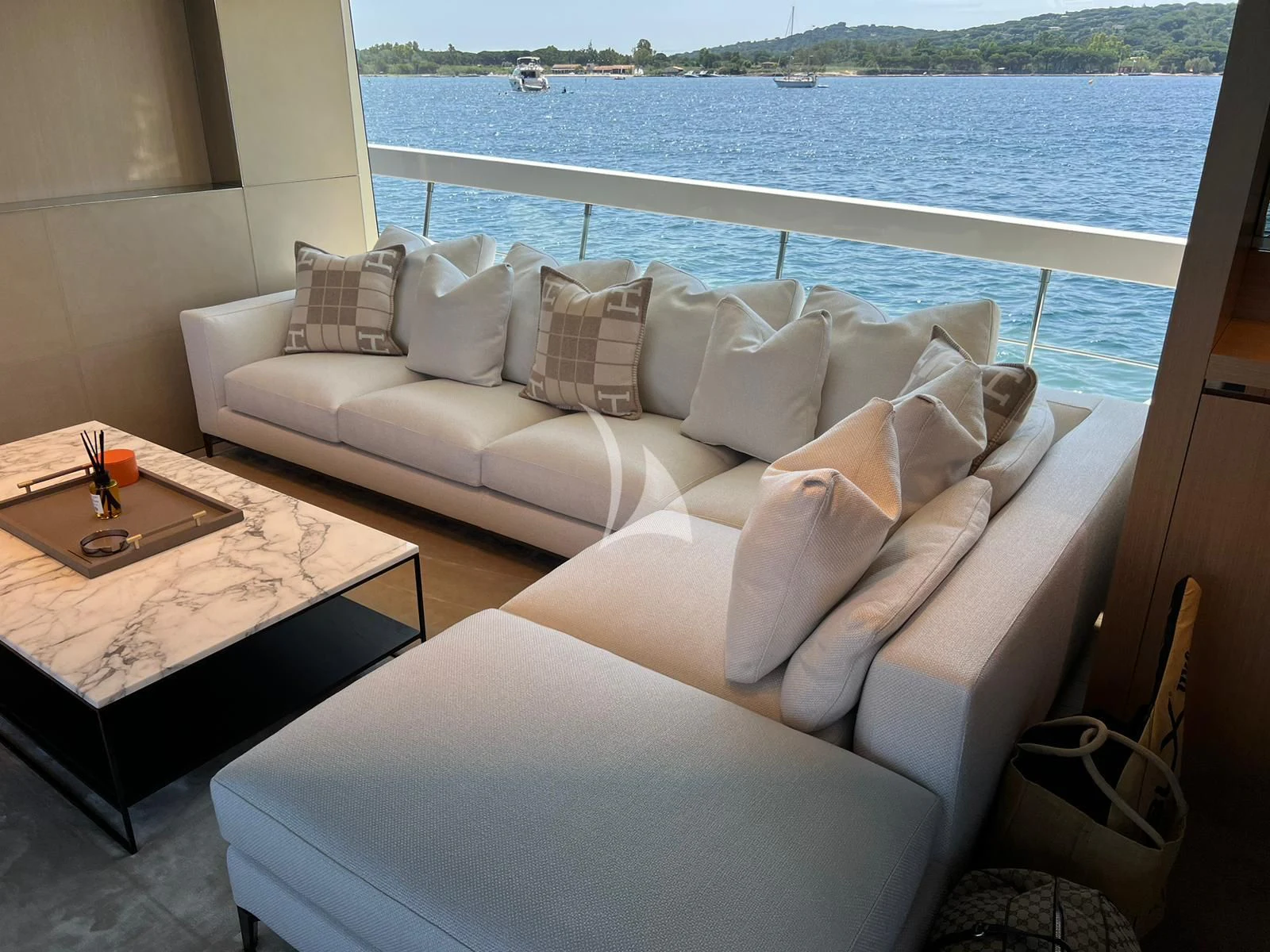 a couch with pillows on it aboard BELLE DE NUIT Yacht for Sale