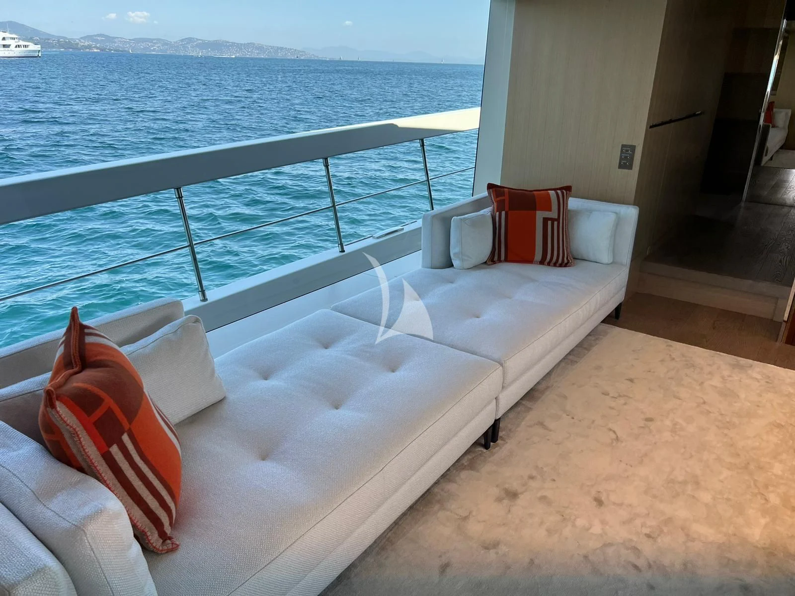 a bed on a balcony overlooking the ocean aboard BELLE DE NUIT Yacht for Sale