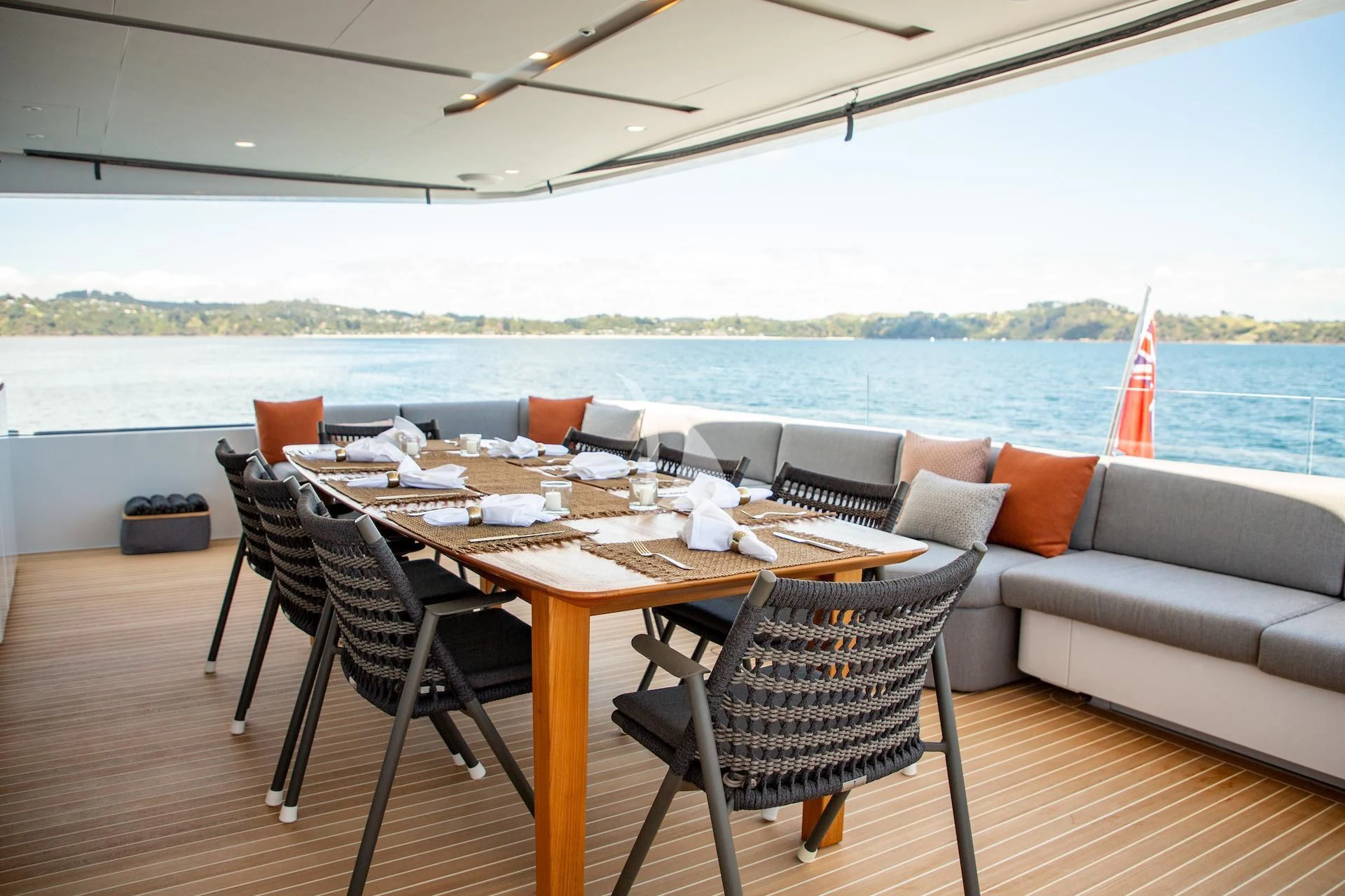 a table and chairs on a patio aboard RUA MOANA Yacht for Sale