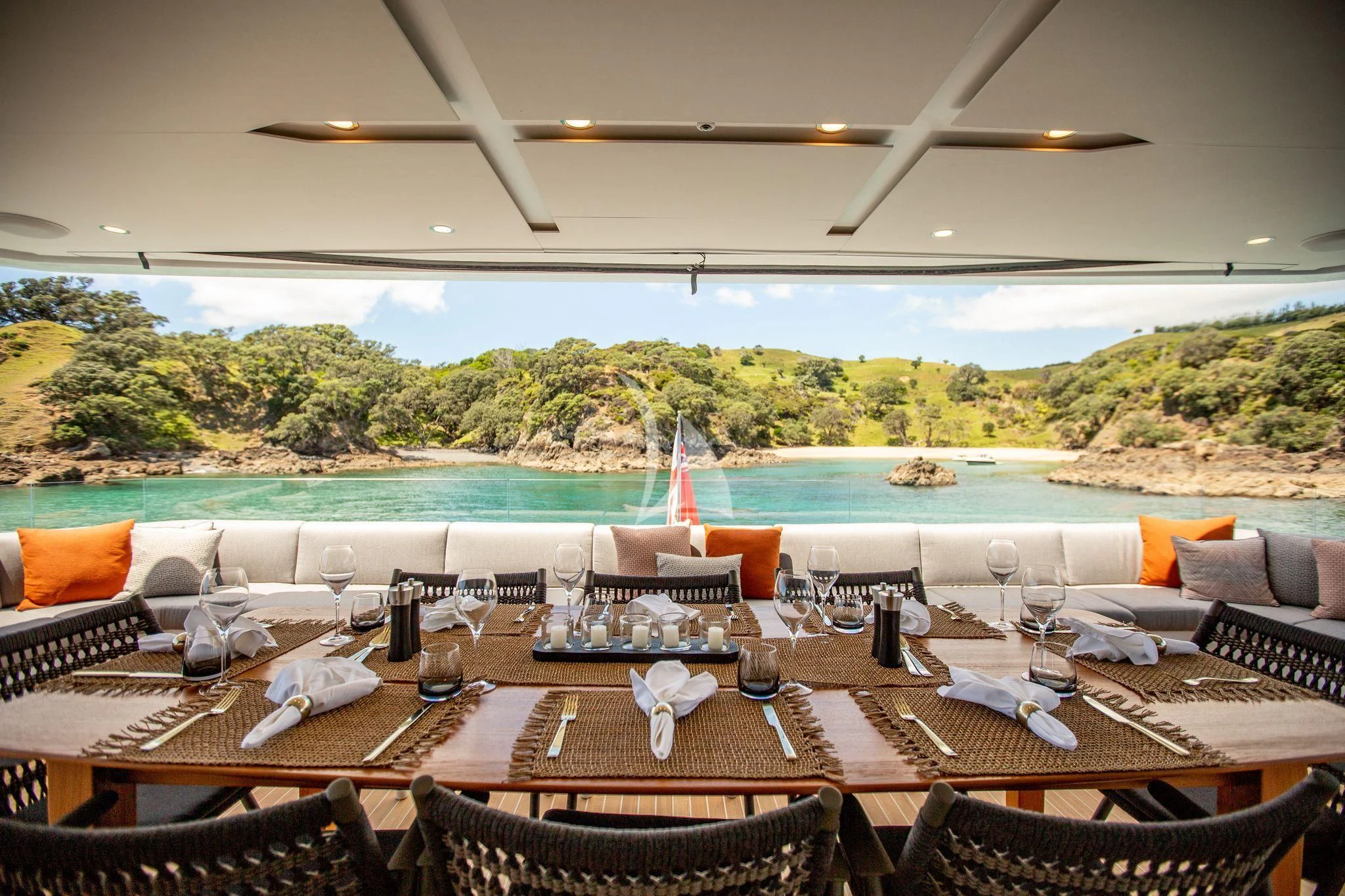 a table set for a dinner party aboard RUA MOANA Yacht for Sale