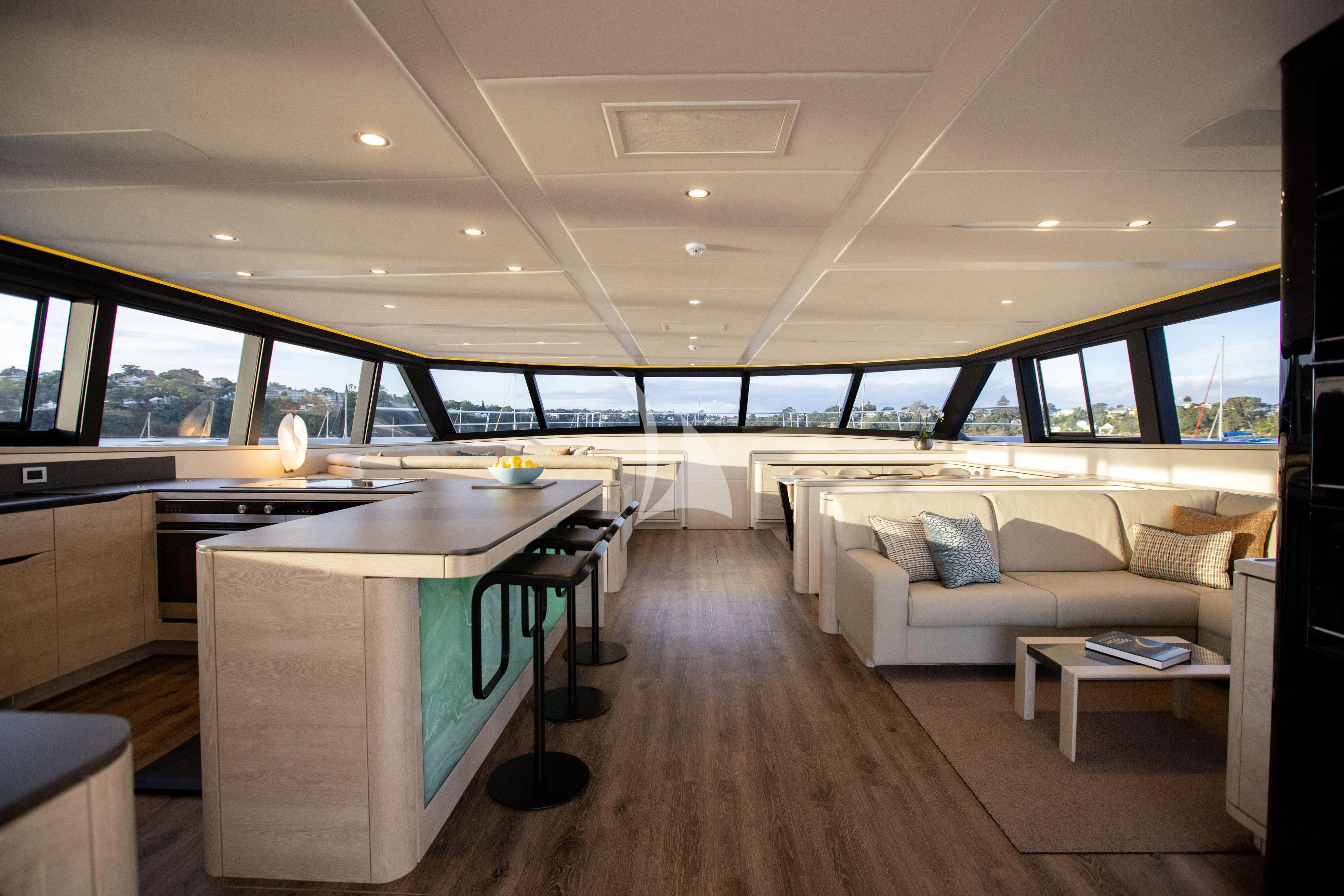 a room with a couch and a table aboard RUA MOANA Yacht for Sale