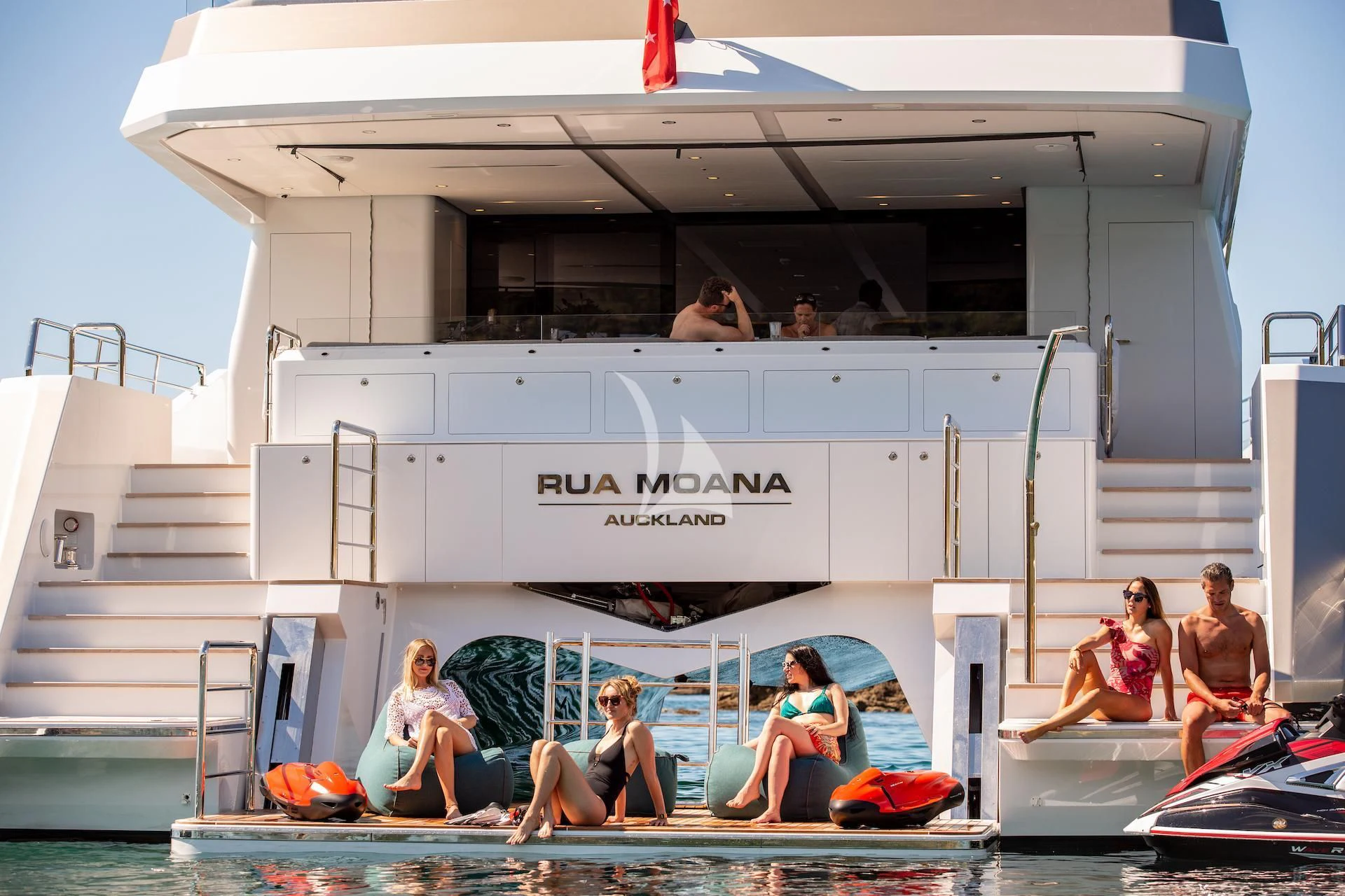 a group of people on a boat aboard RUA MOANA Yacht for Sale