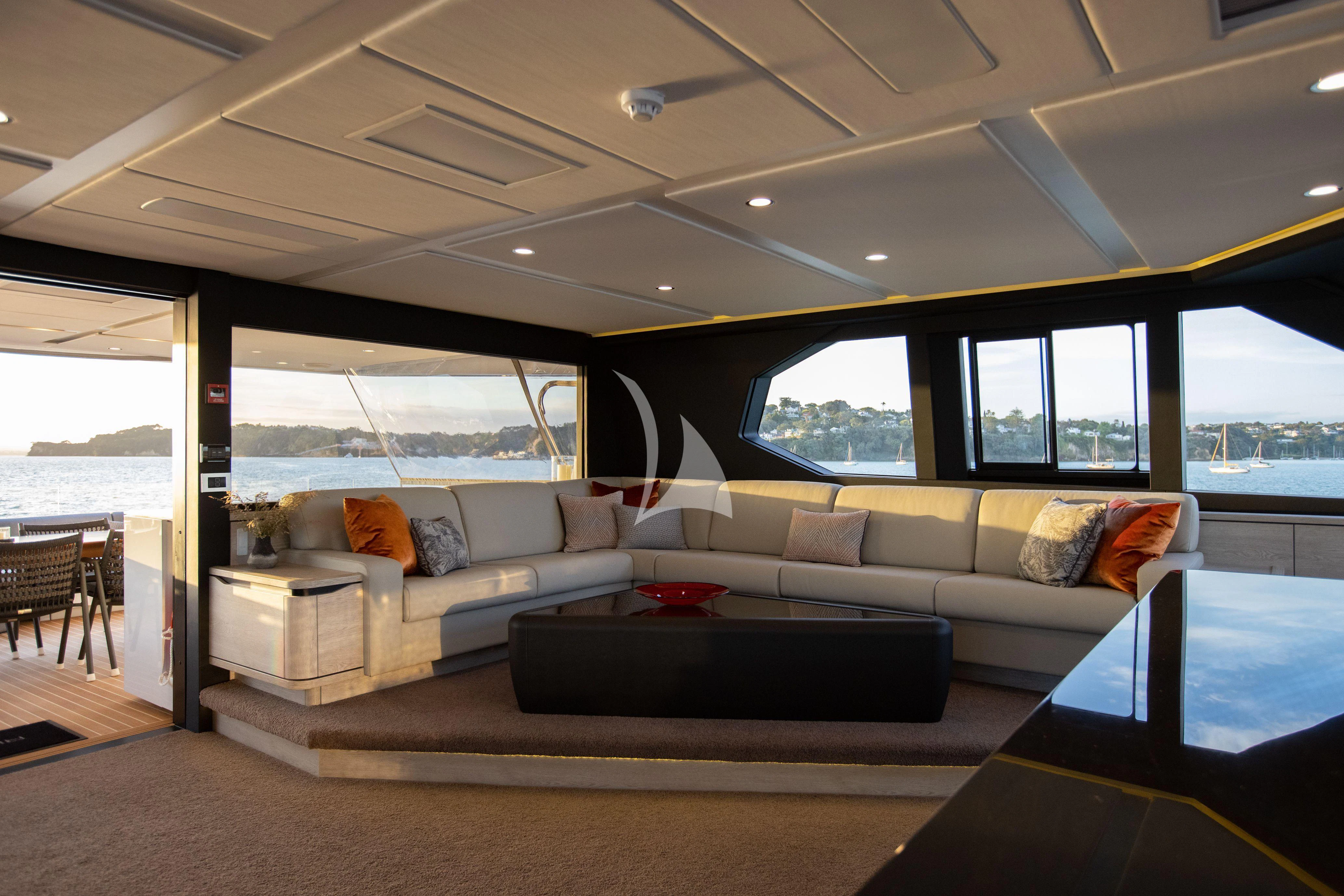 a living room with a large window aboard RUA MOANA Yacht for Sale