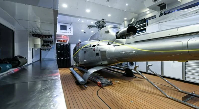 a helicopter in a room aboard PURSUIT Yacht for Sale