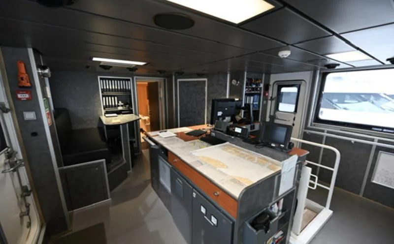 a room with a table and chairs aboard PURSUIT Yacht for Sale