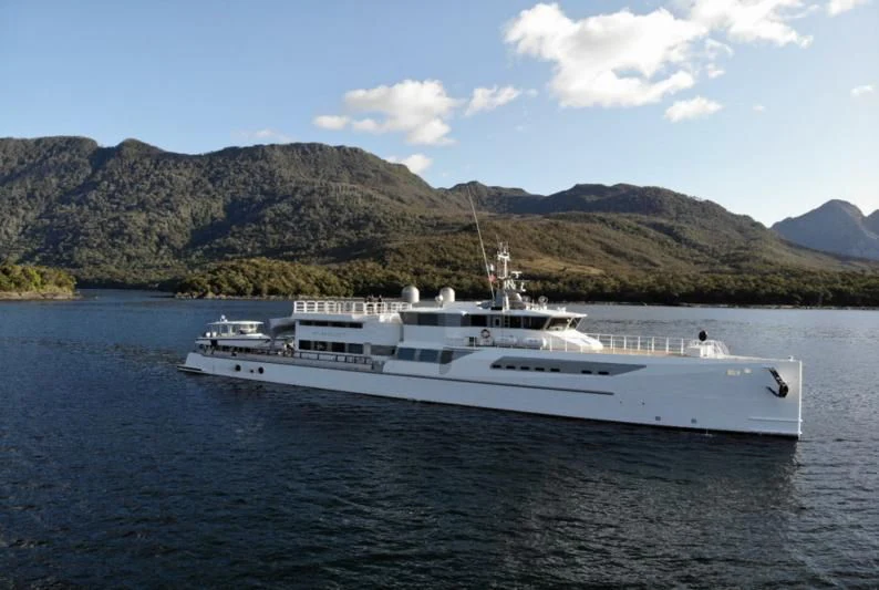 a white boat on water aboard PURSUIT Yacht for Sale