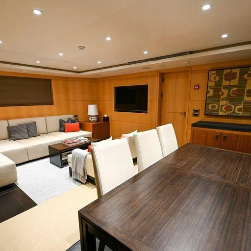 a room with a table and chairs aboard PURSUIT Yacht for Sale