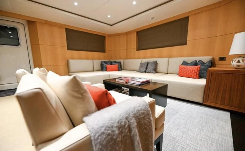 a living room with a couch and a coffee table aboard PURSUIT Yacht for Sale