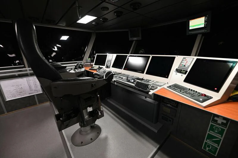 a room with computers and monitors aboard PURSUIT Yacht for Sale