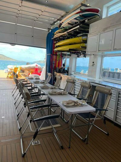 a room with a table and chairs aboard PURSUIT Yacht for Sale