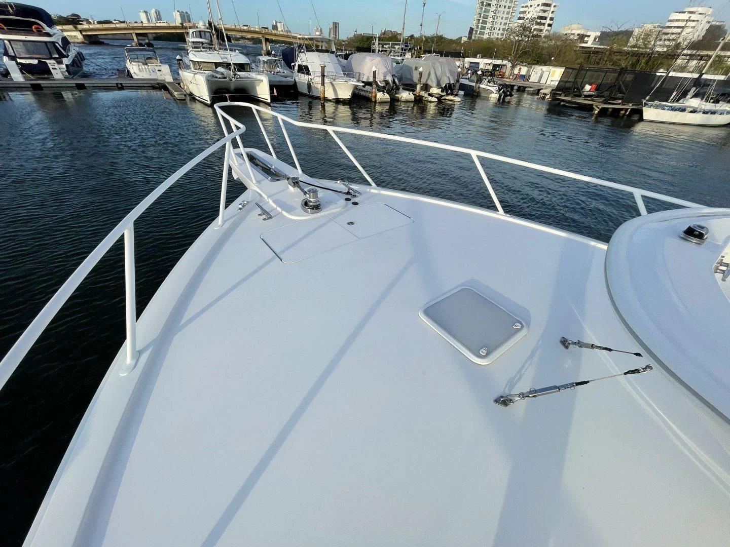 a large boat in a harbor aboard LAST CALL Yacht for Sale